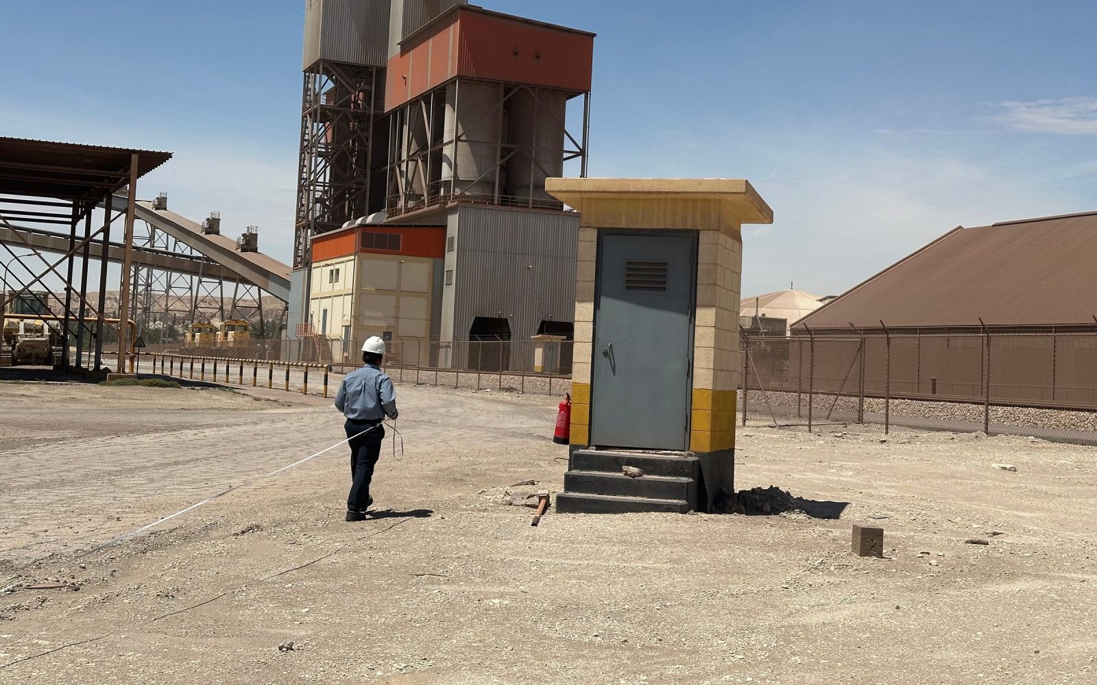 Saudi industrial facility and infrastructure in a desert operating environment.